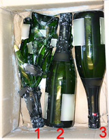 Exemple d'un carton de bouteilles cassées (deuxième rang de bouteilles enlevé)